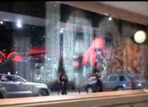 Waterfall art installation with a Jeep, showcasing a 1,000-gallon water feature at The 1,000 Gallon.