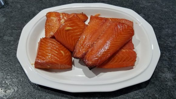 Smoked salmon fillet fresh off the Rec Tec pellet grill with visible smoke rings.