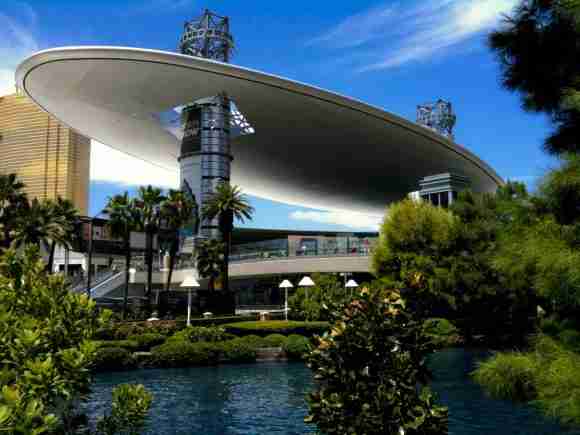 Modern architectural design of a futuristic convention center with a sleek, curved roof in Las Vegas.
